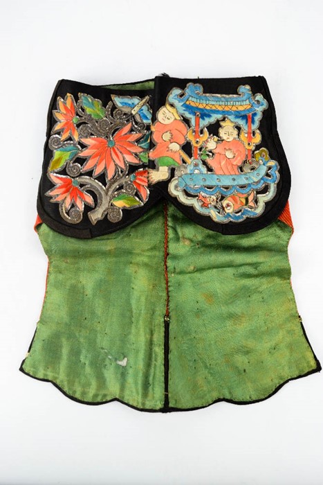 A late 19th century Chinese lady's silk hat with decorative embroidery on paper appliques, depicting