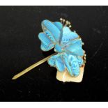 A 19th century Chinese gilt metal and kingfisher feather hair ornament in the form of a flower. 5cms