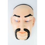 A Beswick ceramic Chinese face mask wall hanging, stamped Beswick verso.