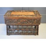 A small Chinese folding table with four dragons and symbols, 37 by 61 by 37cm.