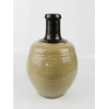 A 20th century stone ware glazed Chinese jar.