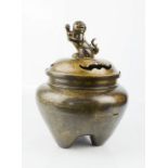 An early bronze censor, modelled with a dog of fo finial and engraved with dragon, sun and temple,