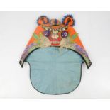 An early 20th century boy's tiger hat, made to confuse evil spirits and protect the wearer,