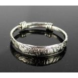 A Tibetan Miau silver carved bangle with dragon design.