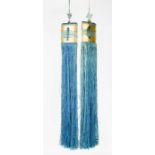 A pair of Chinese silk tassels, in blue and gold, 51cm long.