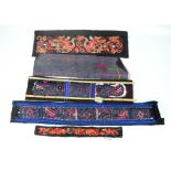 A group of embroidered Miao minority panels from Southern China.