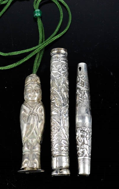 Three 19th century Chinese silver needle cases, including one in the form of a Chinese figure. [