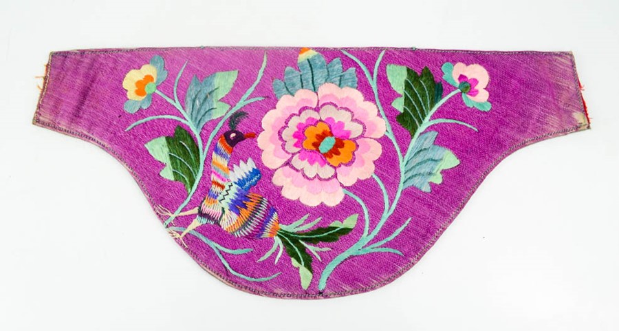 A 19th century Chinese silk embroidered waist pouch, embroidered with a peacock and peonies