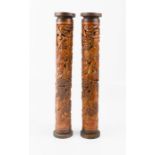 A pair of bamboo carved incense sticks holders, 20th century, depicting figures in landscape, 23cm