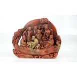 A Chinese carved Shoushan stone figural group carved scroll weight depicting the eight immortals.