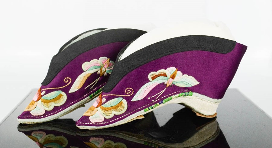 A pair of Chinese silk lotus shoes, circa 1920, the purple silk embroidered to depict butterflies, - Image 3 of 3