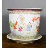 A 20th century Chinese jardiniere depicting a dragon chasing children in a garden, with dish, 24cm