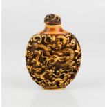 A Chinese carved snuff bottle.