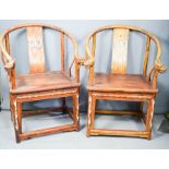 A pair of Chinese throne chairs, with mother of pearl inlaid decoration, and dragon head carved