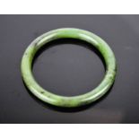 A Chinese Imperial jade bangle .7.5cms diameter externally, 6cms internally