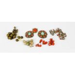 A group of Tibetan amulets in white metal and coral, seven agate/quartz toggles, two sets of