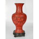 A Chinese cinnabar vase and stand, 26½cm high.