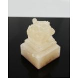 A Chinese carved white agate seal.