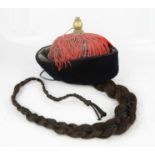 A Chinese Mandarin's winter hat with queue, 7th Rank, with lacquered wooden stand.