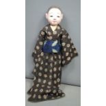 An Itchimatsu doll, late Meiji period (1868-1910), wearing hakama and haori, 61cm long. [Ichimatsu