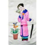 A Chinese embroidery on silk, depicting a woman holding a fan and an umbrella, circa 1930. 40cms x