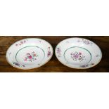 A pair of 19th century Chinese plates, enamelled with floral detail in red and pink, circa 1820,