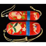 Two Chinese silk applique spectacle cases, circa 1930, both with red silk ground and blue borders,