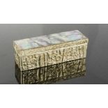 A Chinese mother of pearl and silvered metal box, cast with bamboo and peonies, 9cm long.