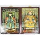 A pair of verre eglomise type reverse painted panels on glass, depicting an Emperor and Empress,