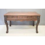 A Chinese 19th century hardwood carved library table, 85 by 84 by 150cm.