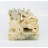 A Chinese Imperial jade seal carved in the form of a mystical beast, four character marks