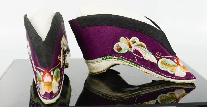 A pair of Chinese silk lotus shoes, circa 1920, the purple silk embroidered to depict butterflies, - Image 2 of 3