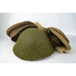 A WWII Mountain Warfare officers cap, together with tin helmet with net.
