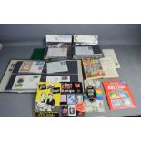 A group of stamp collectors reference books, an album of First Day Covers, an album of used stamps
