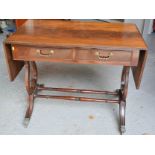 A mahogany sofa table with two drawers.