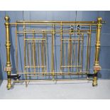 A Victorian brass bed, with canopy brackets.