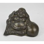 A bronzed metal buddha.