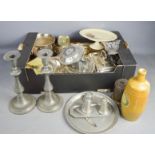 A group of silverplate ware, including lidded tureens, a pair of pewter candlesticks, ceramics and