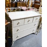 A Chinese style white painted chest of drawers, with bamboo style borders.