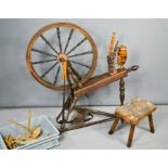 A spinning wheel and a stool.