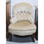 A Victorian cream upholstered button back nursing chair.