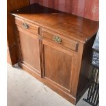 A mahogany cupboard with two drawers.