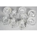 A quantity of antique glass furniture rests, and a group of salts / candle holders.