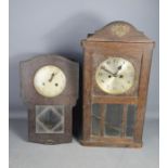 Two wall clocks.