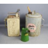 Three oil cans; Valor, Aladdin pink paraffin lamp and Halfords examples.