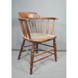 An oak smokers bow armchair.