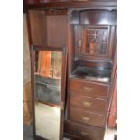 A mahogany wardrobe with drawers and mirrored front, 194 by 122cm. A/F