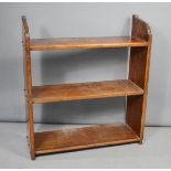 An oak bookshelf, oak cupboard and mahogany wall mirror. Bookshelf measures 76cms tall x 68cms