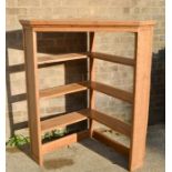 An antique pine corner shelf unit.