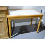 A beech tile top kitchen table, 109 by 65.5cm together with a pine stool.